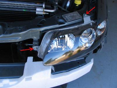 6. Remove 3 bolts holding headlamp in place